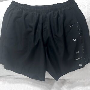 Men’s Nike lined running shorts Black size Large with reflective letters
